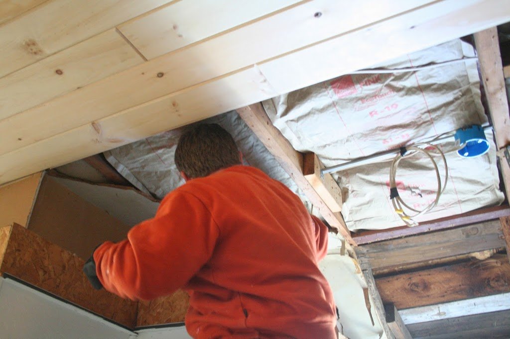 adding more insulation to the tiny cottage ceiling 