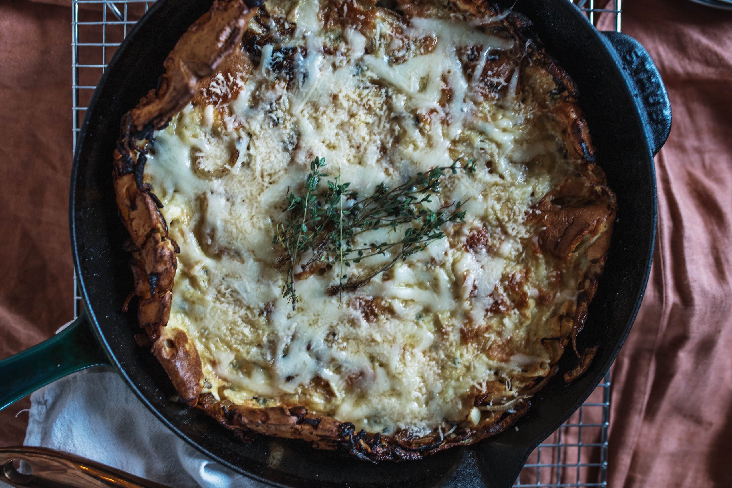 Egg Gruyere Cheese Thyme Egg and Onion bake in a cast iron skillet 