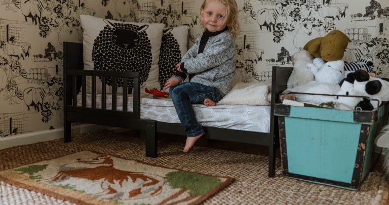 Otto and his new Jute Rug for his gender neutral sheep bedroom