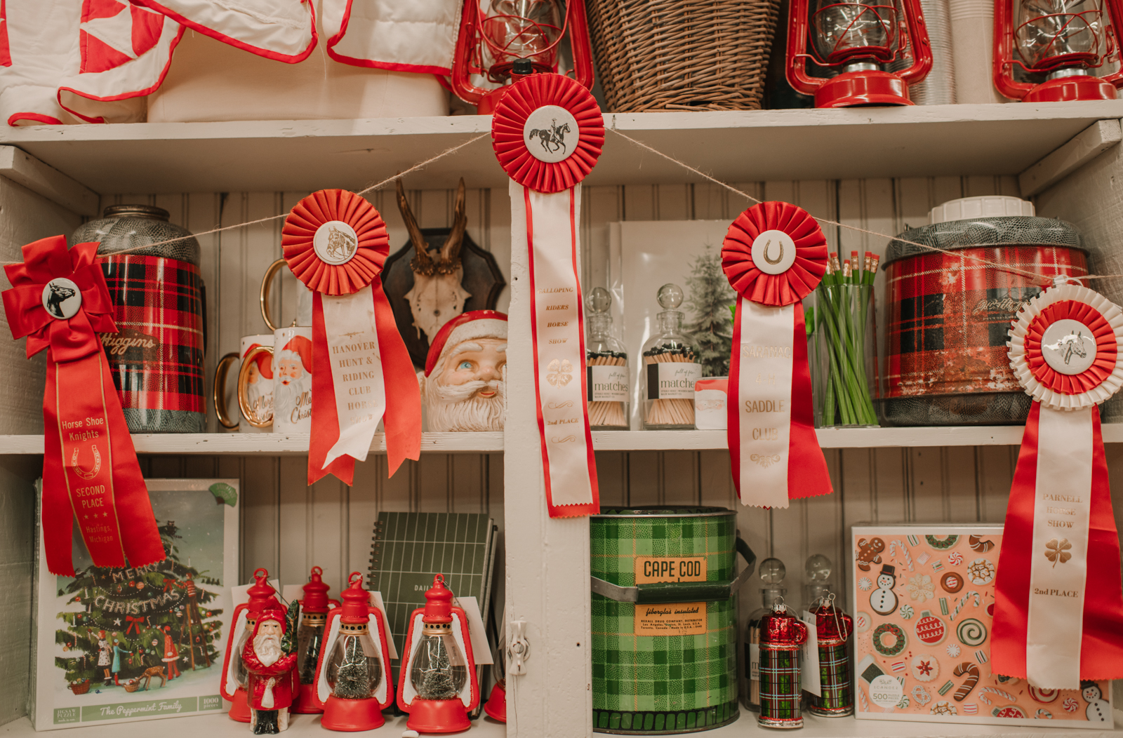 Decorating with Red 4H ribbons at the found Cottage Open HOuse for the holidays