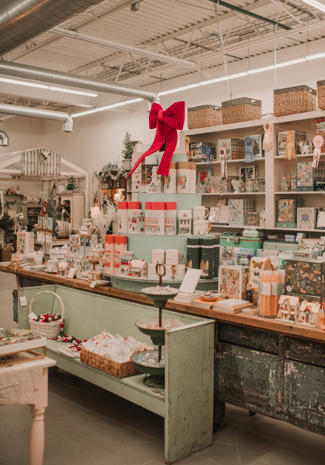 Paper and Gift Retail Section. Many cards and books stacked on an antique table