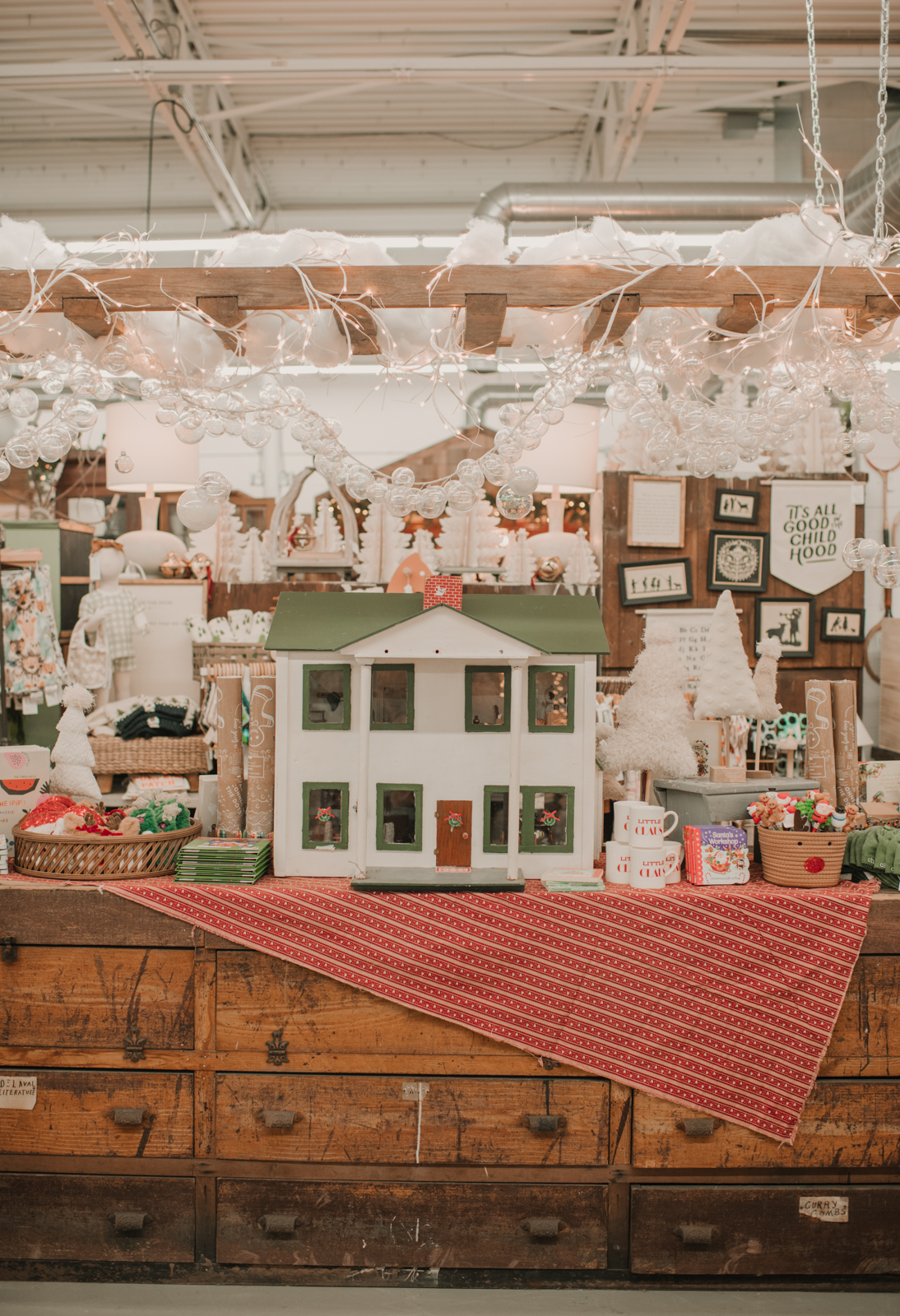 The Kids Shopping Section at the Found Cottage. LArge doll hosue with bubble Garland