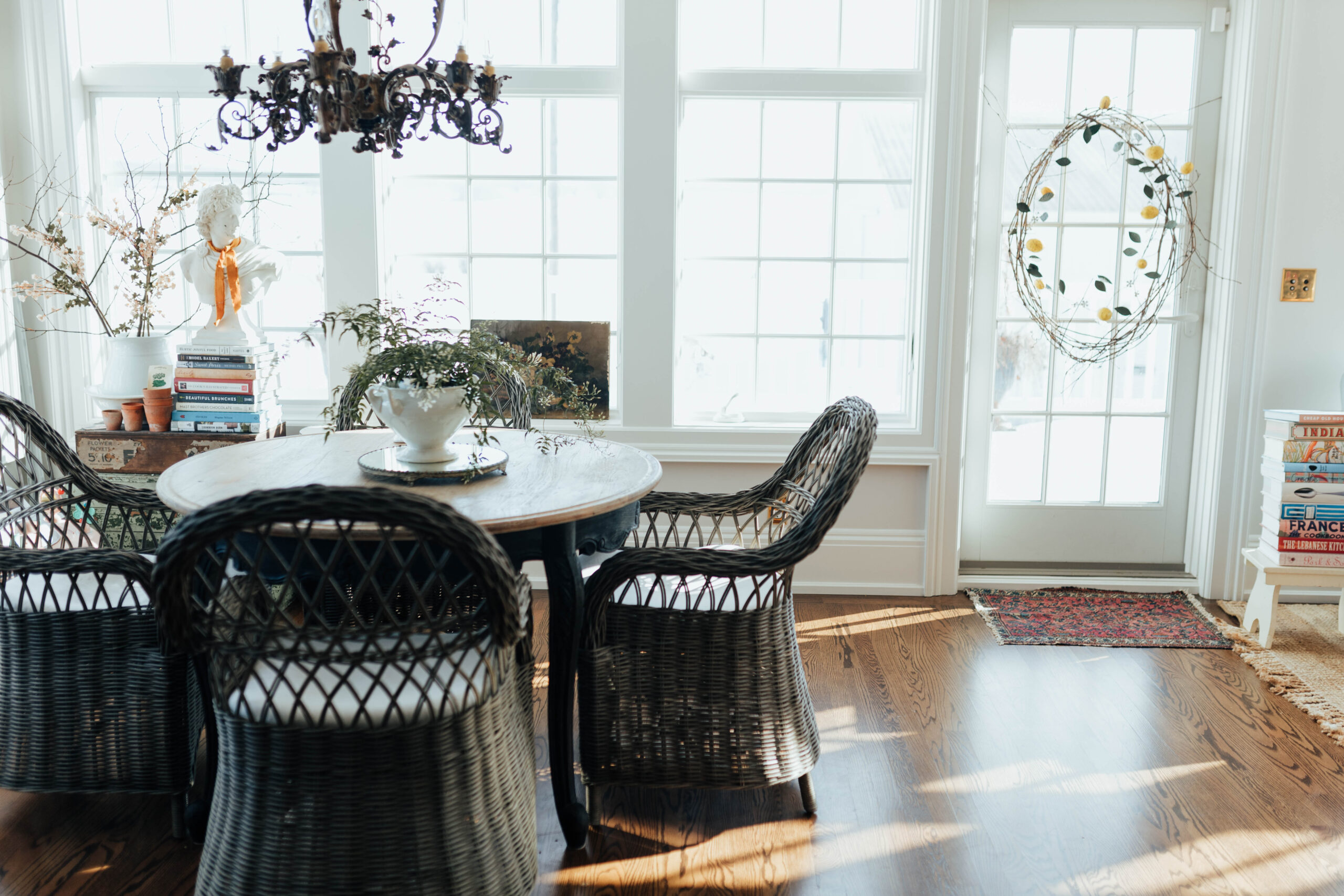 Anthropologie round table with antique french chandelier 